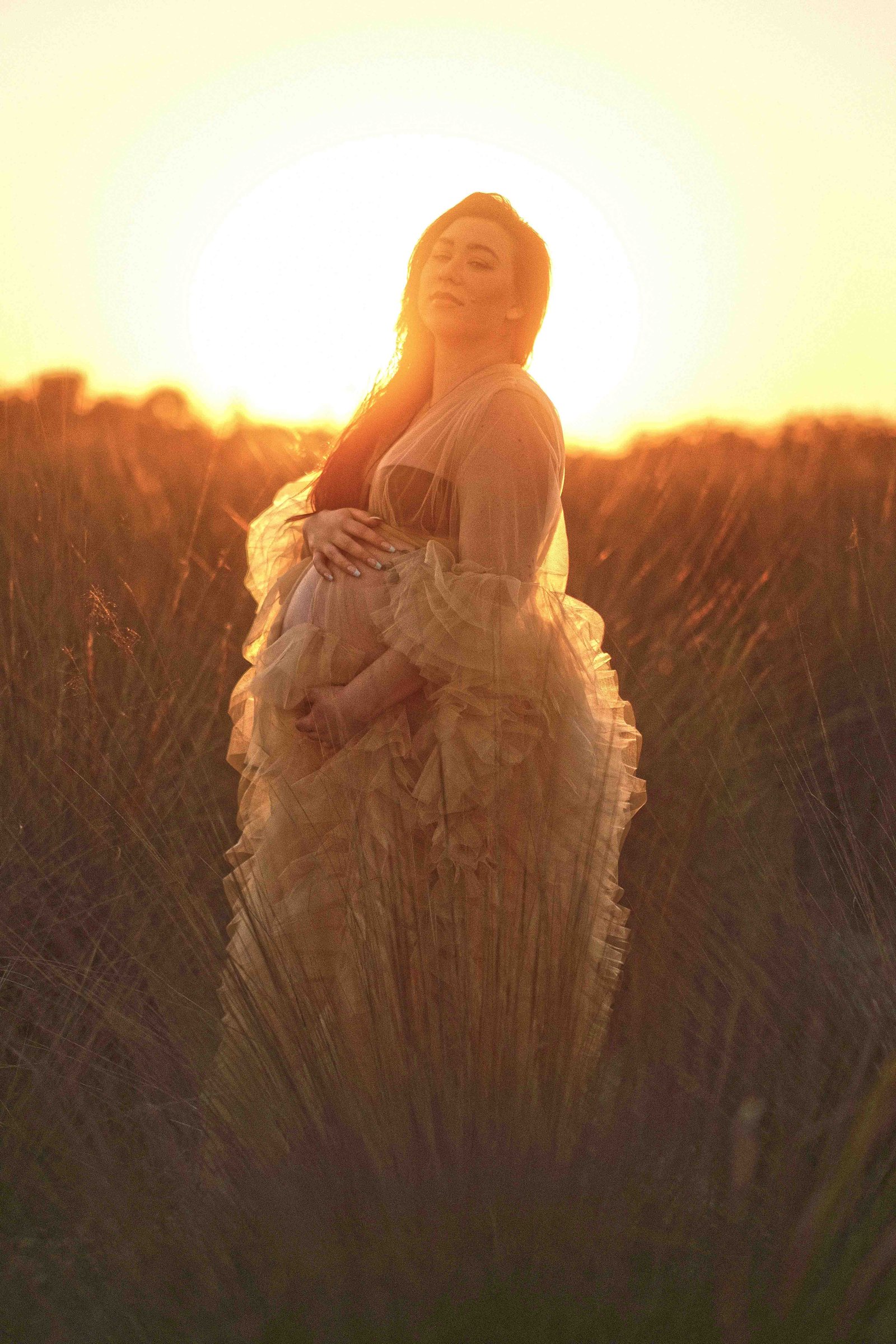 Maternity photography session at golden hour in Jupiter